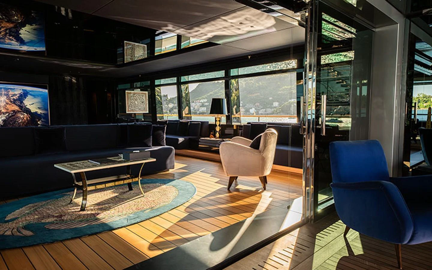 The salon features luxurious seating with panoramic views and elegant decor. aboard REGINA D'ITALIA Yacht for Sale