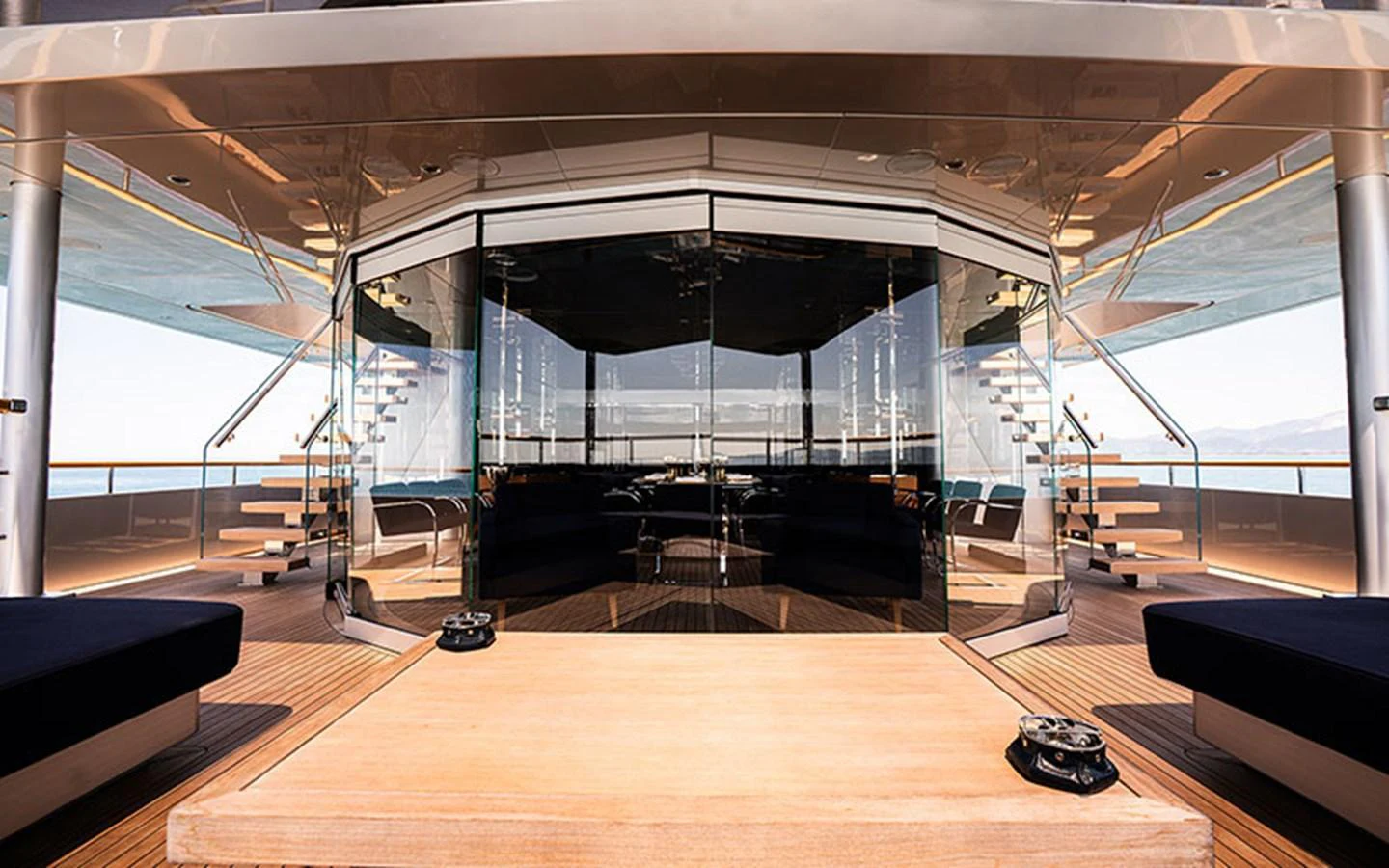 The aft deck features a spacious seating area with a sleek, modern design and panoramic views. aboard REGINA D'ITALIA Yacht for Sale