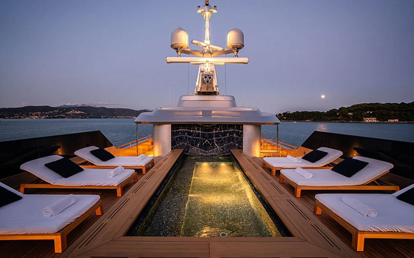 The sundeck features a luxurious pool surrounded by comfortable loungers, perfect for relaxation. aboard REGINA D'ITALIA Yacht for Sale