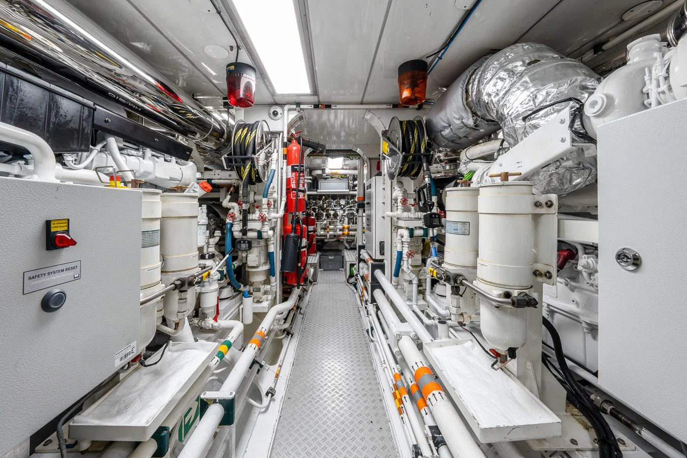 The image showcases the yacht's meticulously organized engine room with advanced machinery and equipment. aboard ATHOS Yacht for Sale