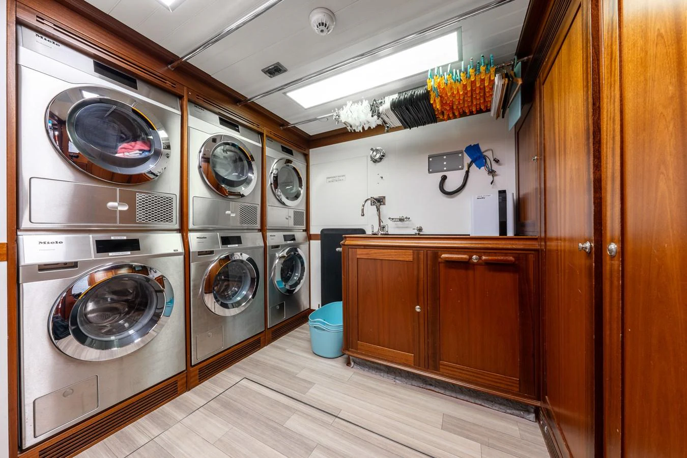 The yacht's laundry room is equipped with modern appliances and ample storage space. aboard ATHOS Yacht for Sale