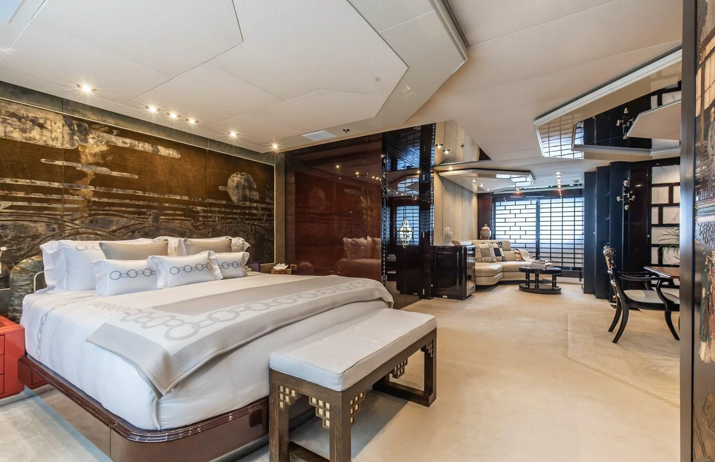 The master stateroom features a luxurious bed, elegant seating area, and sophisticated decor. aboard LADY MARINA Yacht for Sale