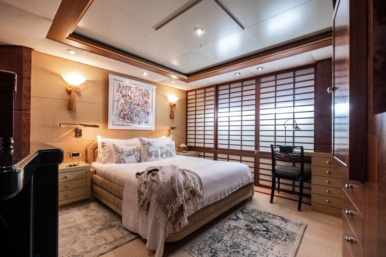 The stateroom features a luxurious bed with elegant decor and ample natural light. aboard LADY MARINA Yacht for Sale