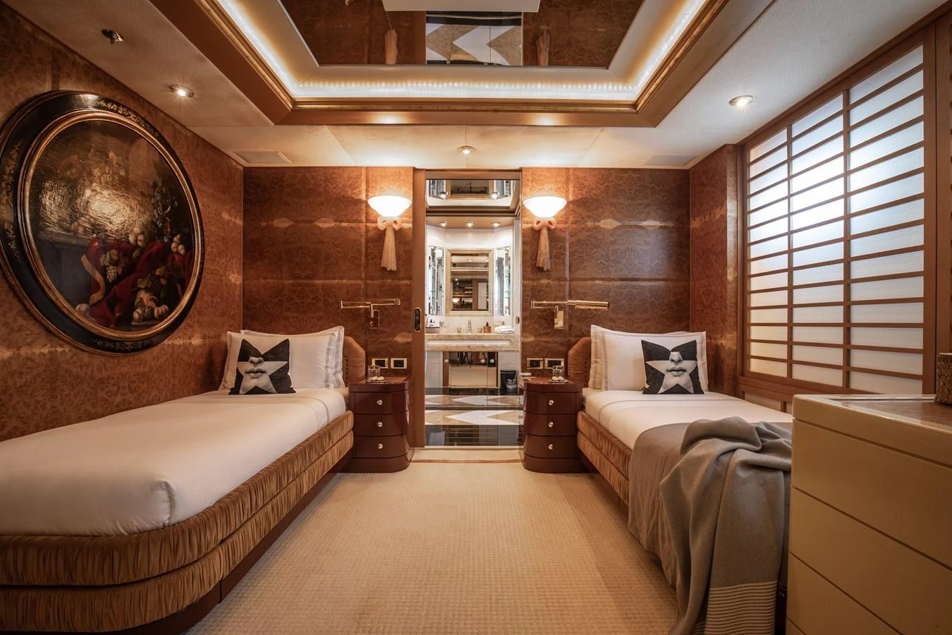 The guest stateroom features twin beds, elegant wood paneling, and luxurious decor. aboard LADY MARINA Yacht for Sale