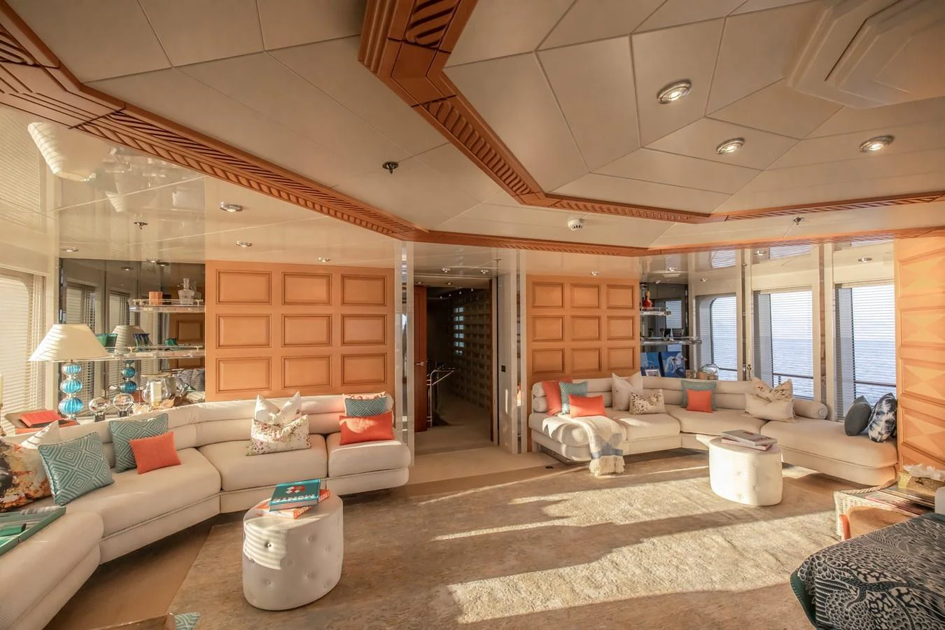The spacious salon features luxurious seating and elegant decor with ample natural light. aboard LADY MARINA Yacht for Sale