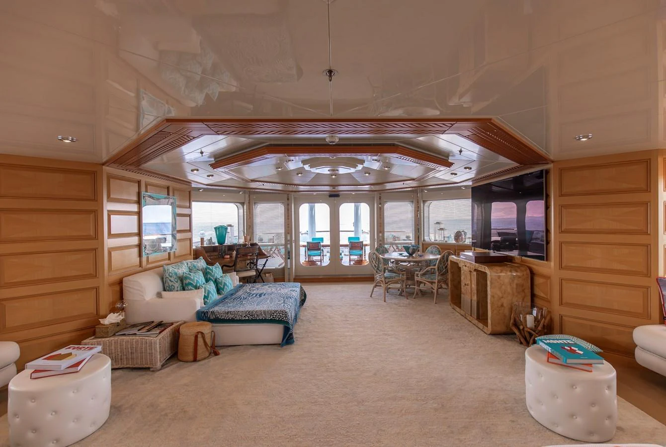 The yacht's salon features luxurious seating, elegant wood paneling, and expansive windows offering stunning views. aboard LADY MARINA Yacht for Sale