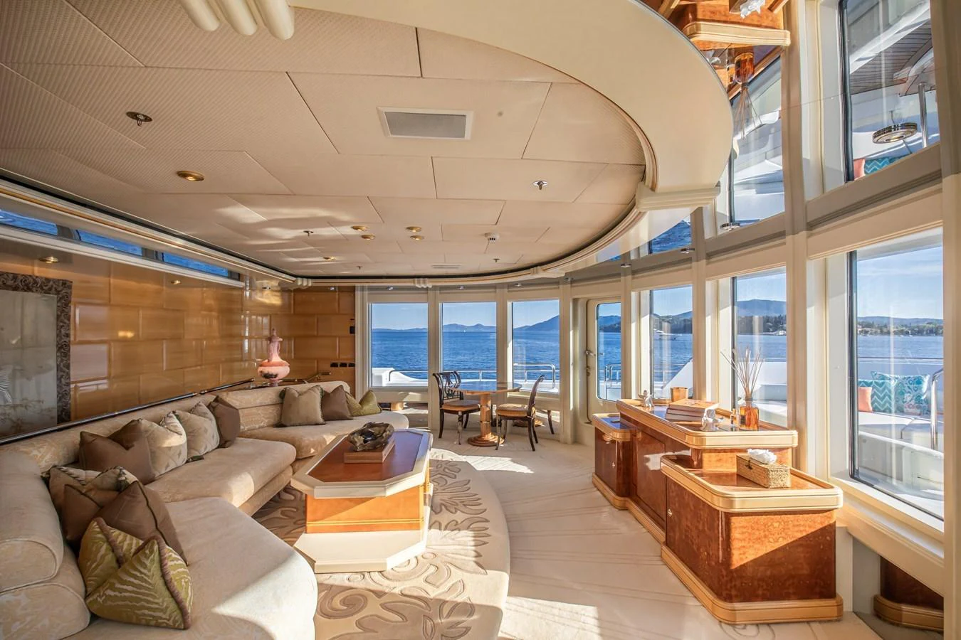 The salon features expansive windows offering stunning ocean views and luxurious, comfortable seating. aboard LADY MARINA Yacht for Sale