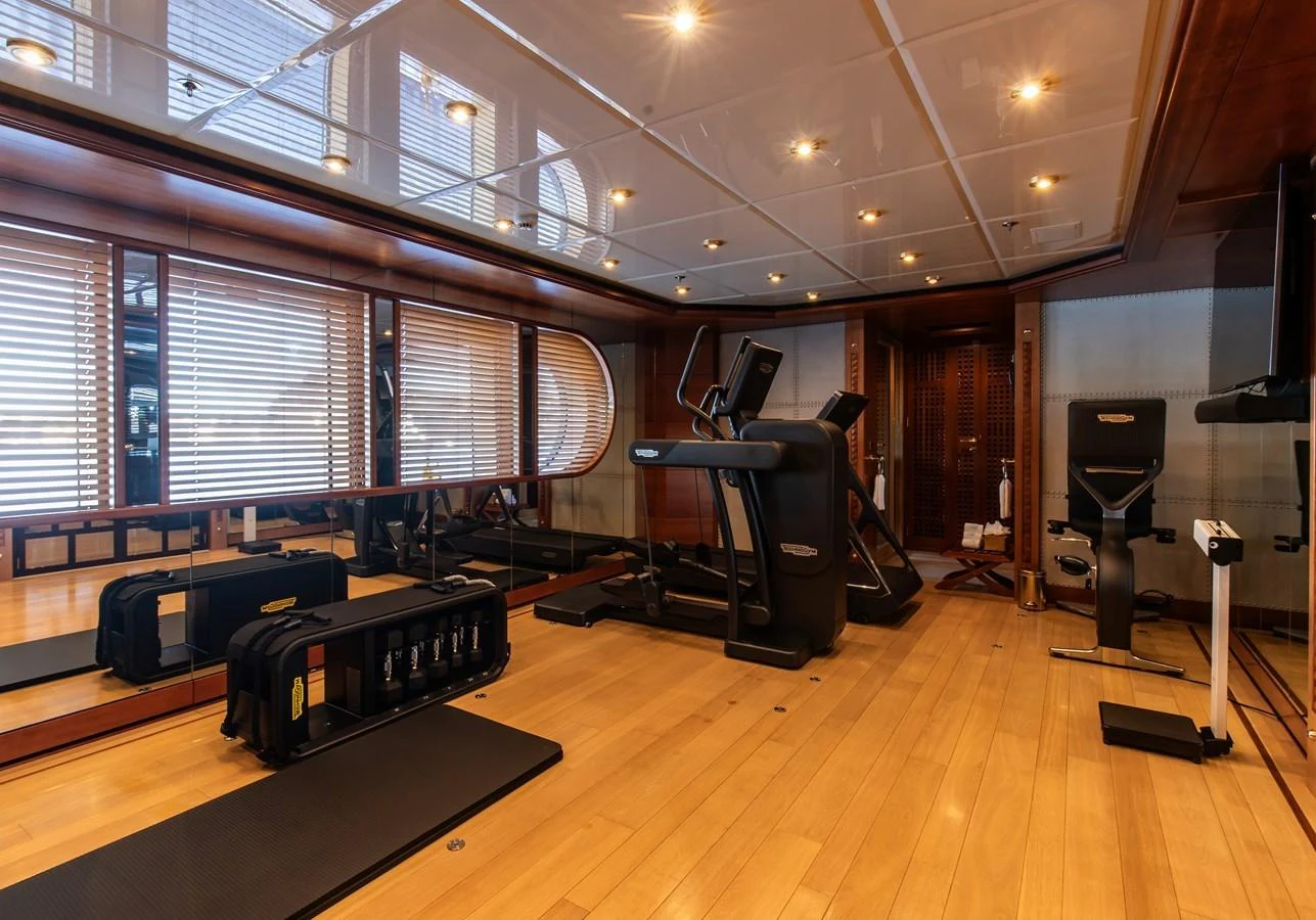 The yacht features a well-equipped gym with modern fitness equipment and ample space for workouts. aboard LADY MARINA Yacht for Sale