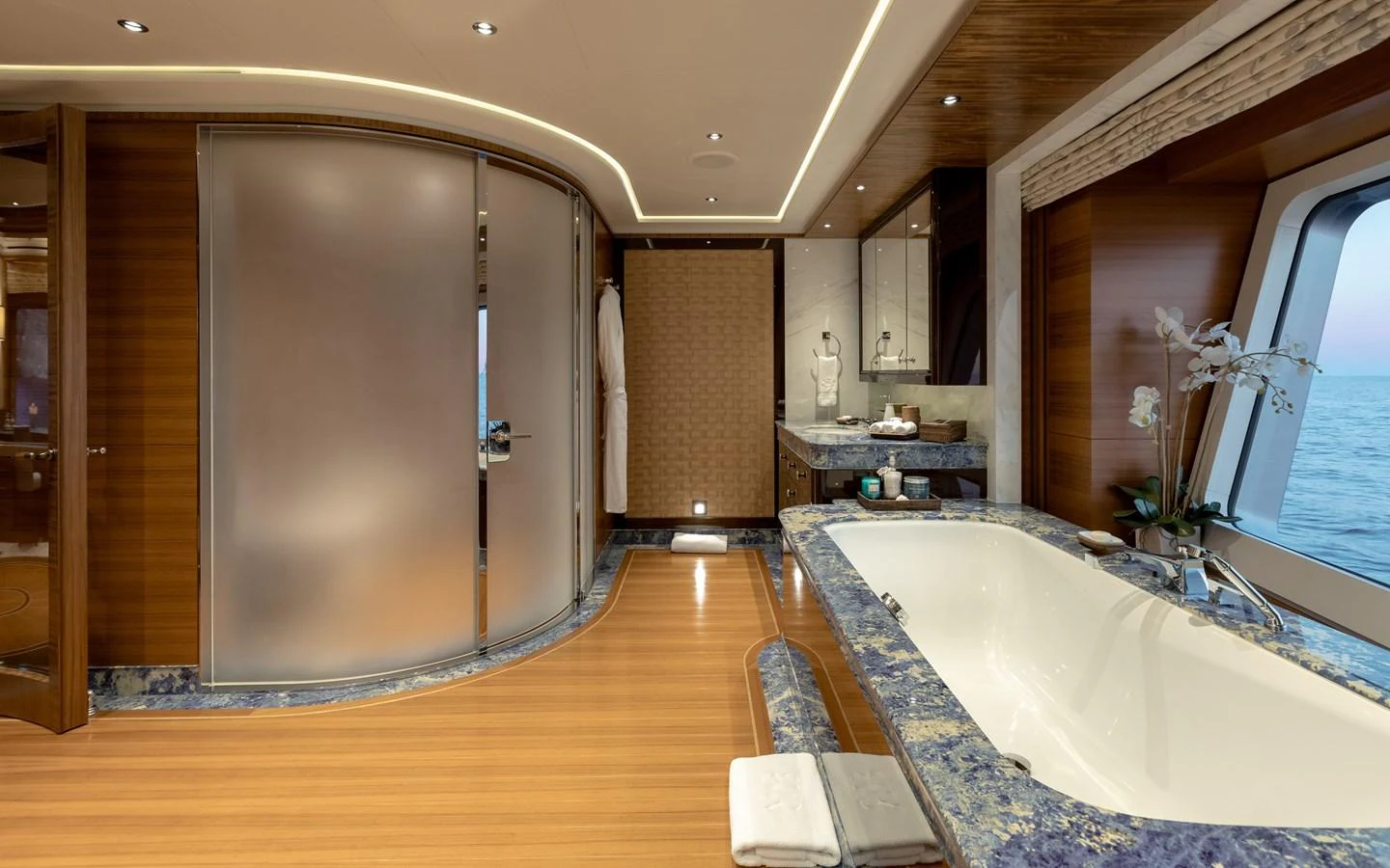 The luxurious bathroom features a large bathtub with ocean views and elegant finishes. aboard BATON ROUGE Yacht for Sale
