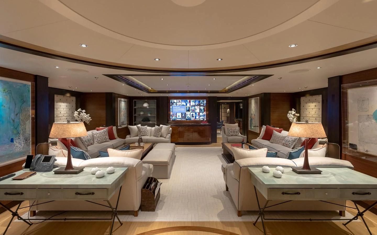 The salon features luxurious seating, elegant decor, and a large flat-screen TV, creating a perfect space for relaxation and entertainment. aboard BATON ROUGE Yacht for Sale
