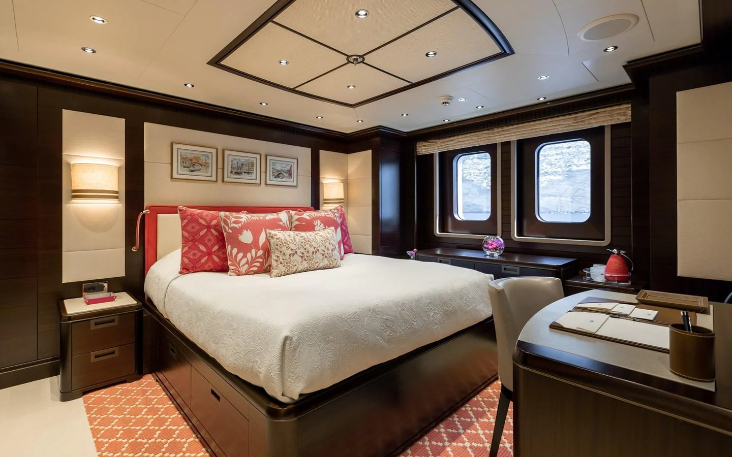 The master stateroom features a luxurious bed with elegant decor and ample natural light from the windows. aboard BATON ROUGE Yacht for Sale