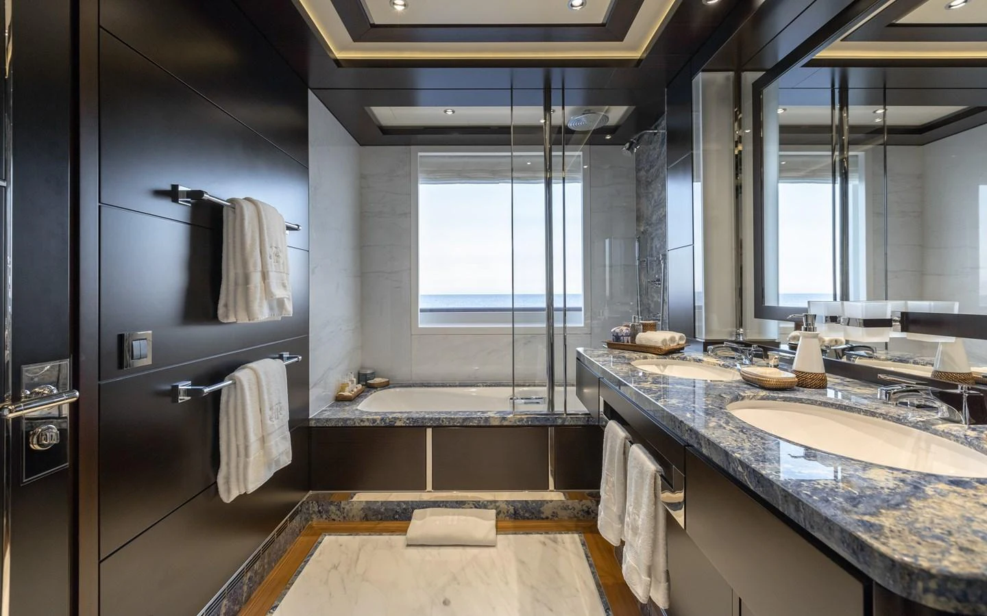 A luxurious yacht bathroom with elegant fixtures and a stunning ocean view. aboard BATON ROUGE Yacht for Sale