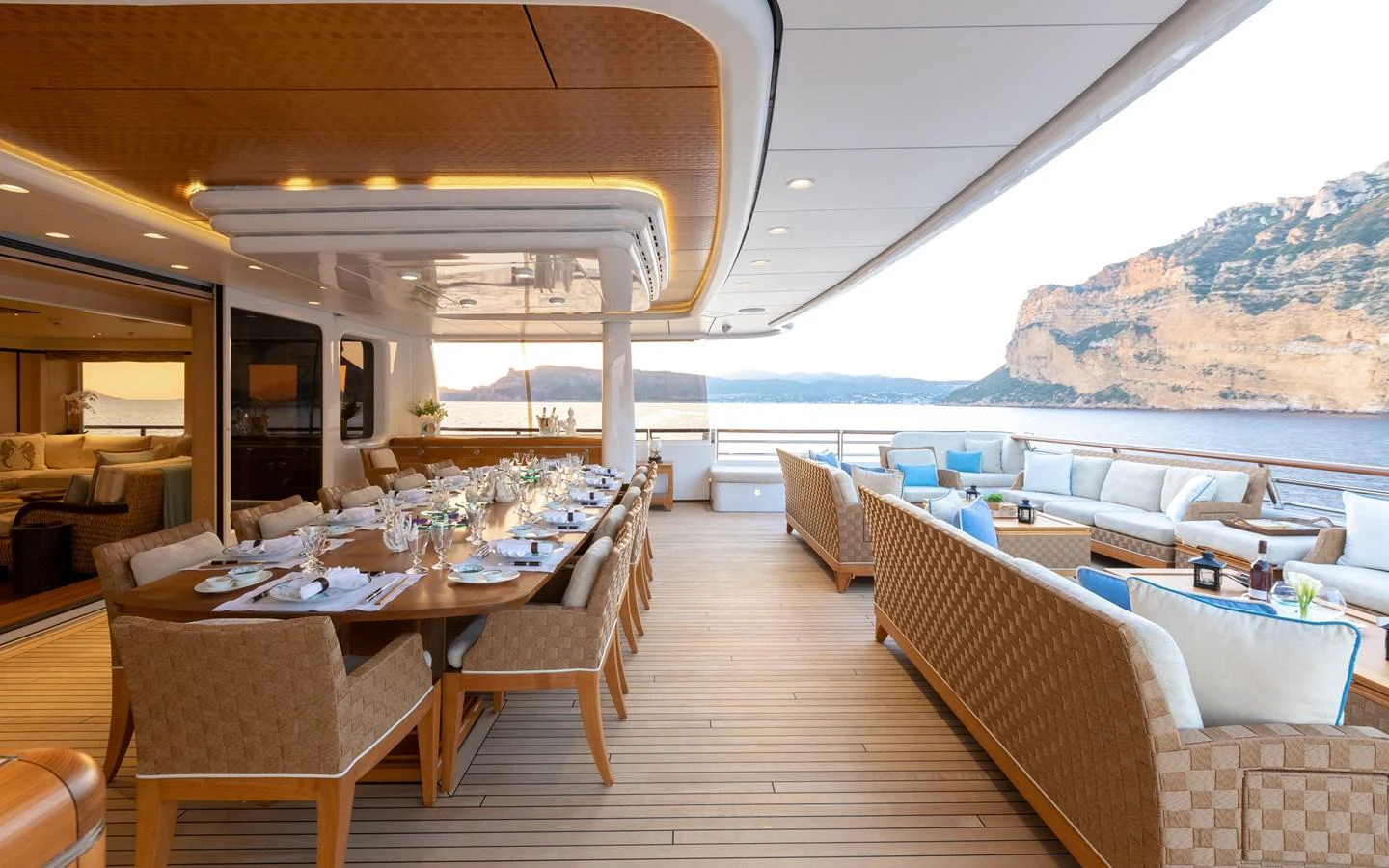 The aft deck features an elegant dining area with a stunning ocean view. aboard BATON ROUGE Yacht for Sale