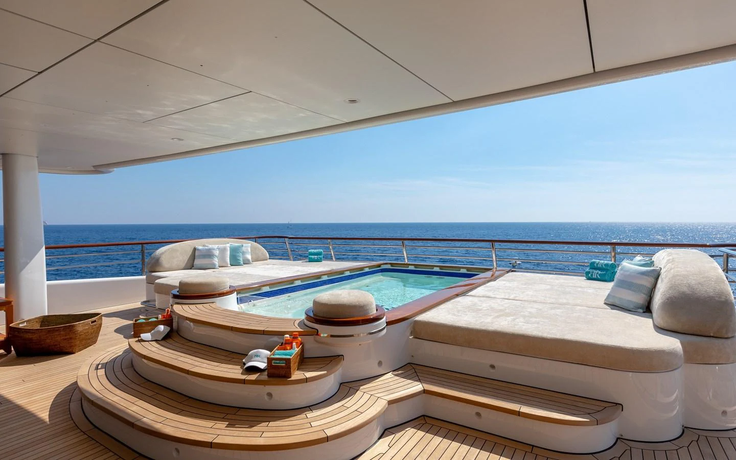 The sundeck features a luxurious jacuzzi surrounded by comfortable sun loungers, offering a perfect spot for relaxation with stunning ocean views. aboard BATON ROUGE Yacht for Sale