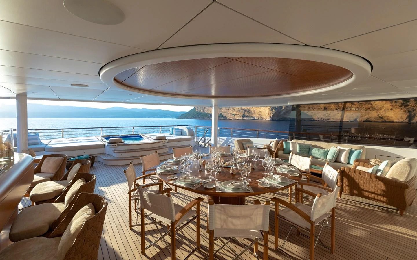 The aft deck offers a luxurious dining area with stunning ocean views and comfortable seating. aboard BATON ROUGE Yacht for Sale
