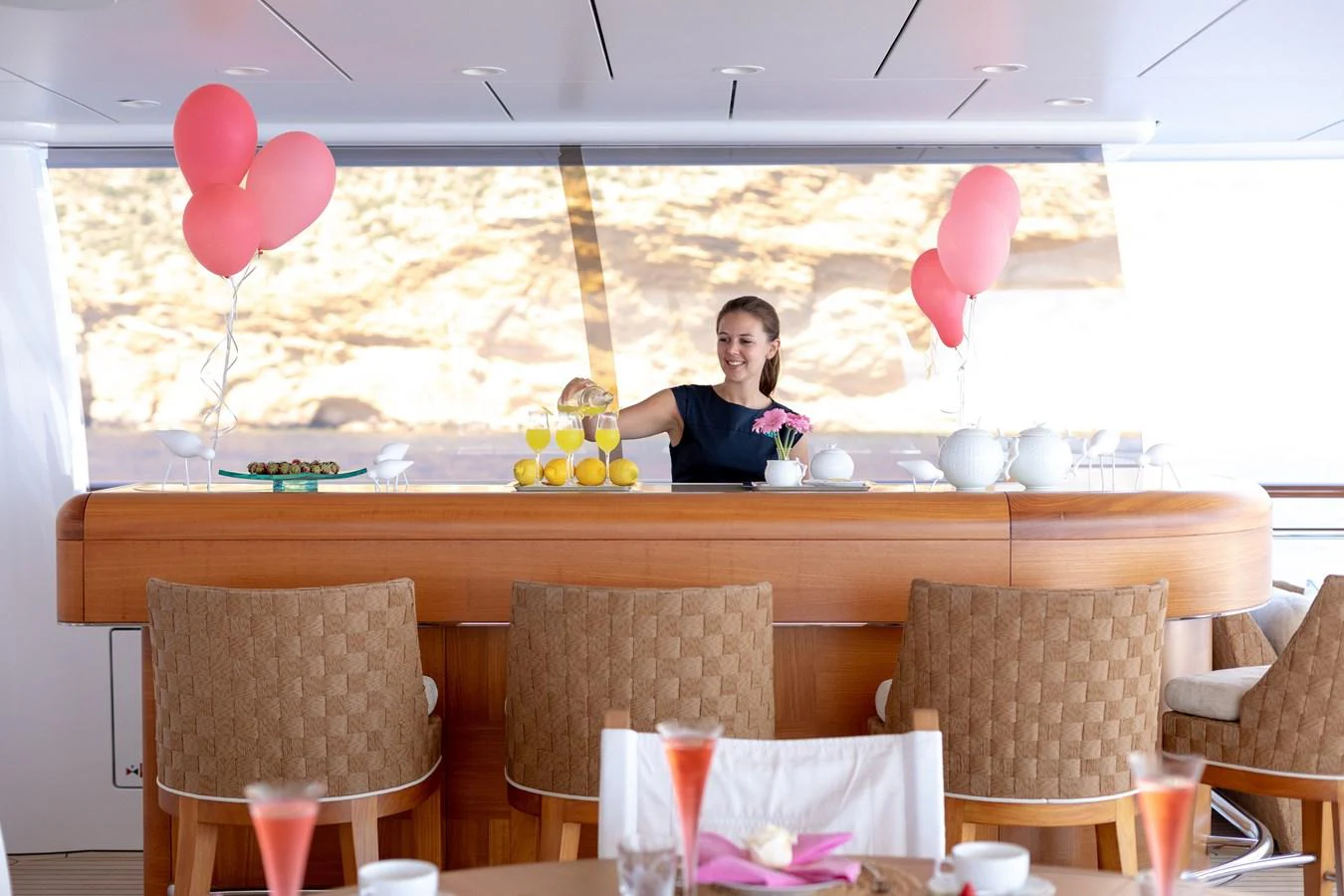The yacht's bar area is elegantly set up with refreshments and a welcoming atmosphere. aboard BATON ROUGE Yacht for Sale