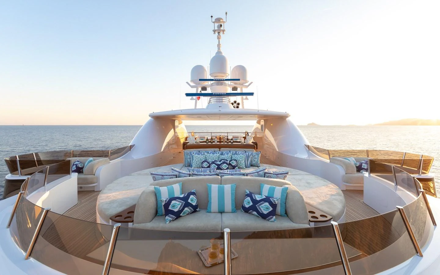 The yacht's foredeck features luxurious seating with plush cushions and panoramic ocean views. aboard BATON ROUGE Yacht for Sale