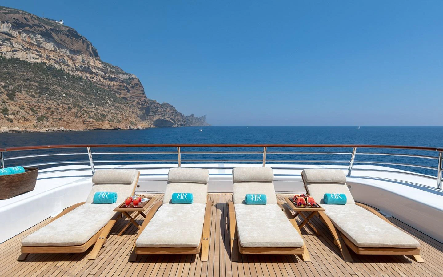 The sundeck features luxurious sun loungers with a stunning ocean view. aboard BATON ROUGE Yacht for Sale