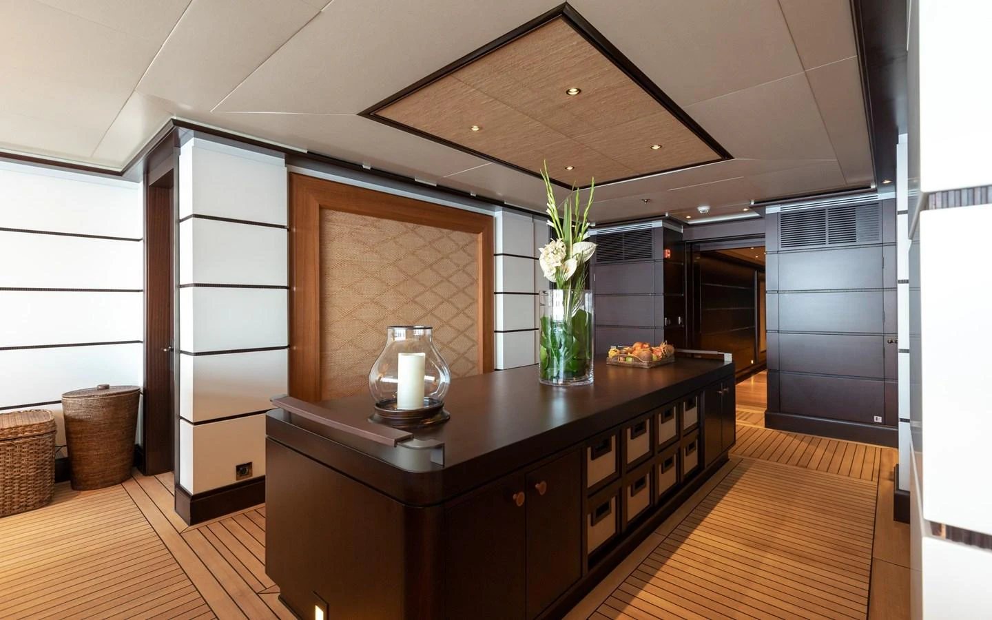 The galley features elegant wood finishes and modern amenities, creating a warm and inviting atmosphere. aboard BATON ROUGE Yacht for Sale