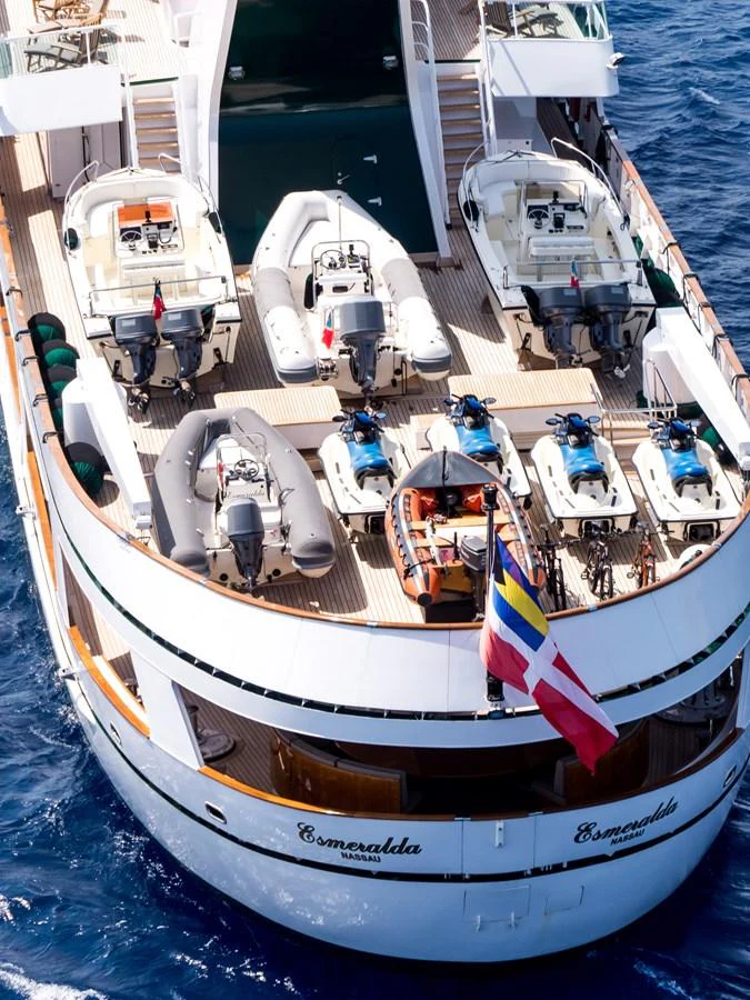 The yacht's deck is equipped with multiple tenders and water toys, ready for adventure. aboard ESMERALDA Yacht for Sale