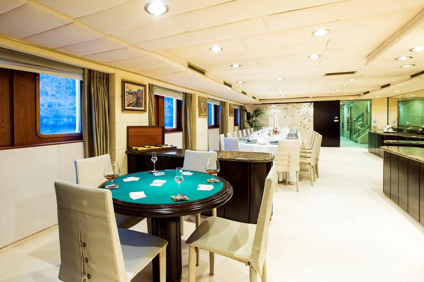 The yacht's interior dining area exudes elegance with its spacious layout and refined furnishings. aboard ESMERALDA Yacht for Sale