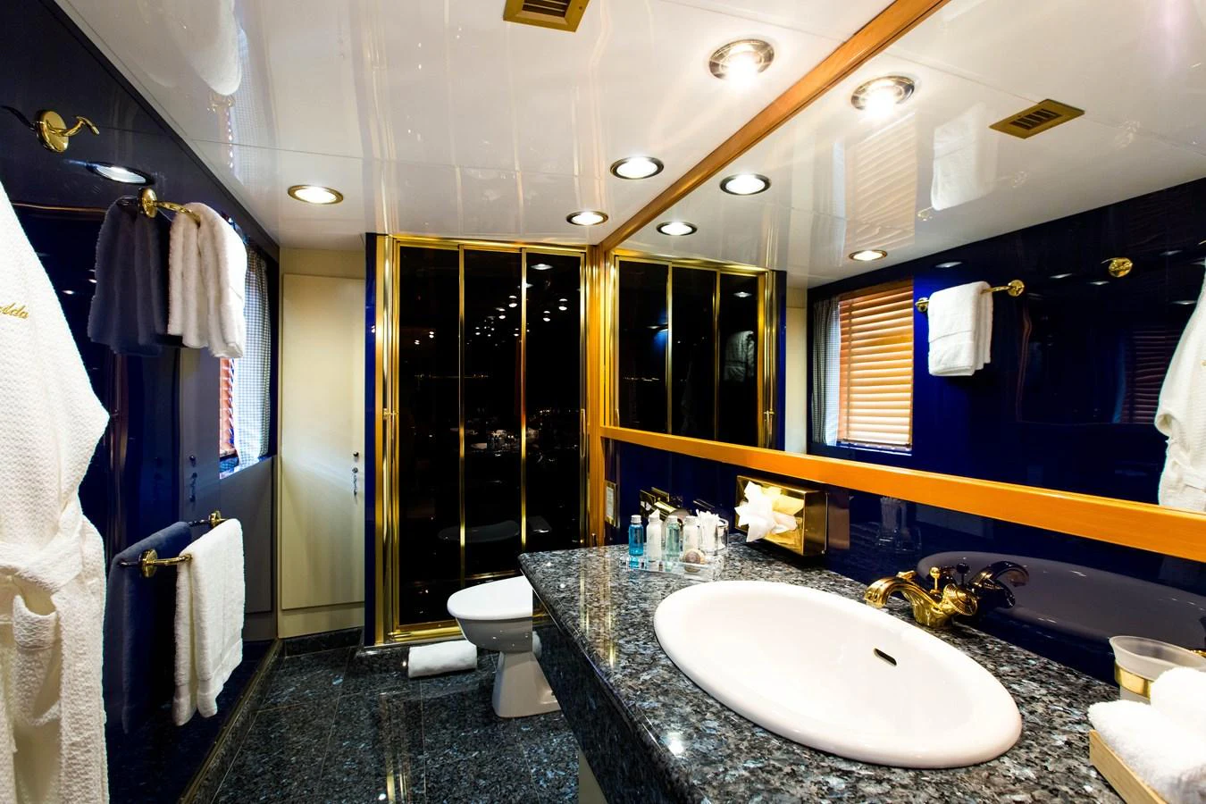 The yacht's bathroom features luxurious finishes with a spacious layout and elegant fixtures. aboard ESMERALDA Yacht for Sale