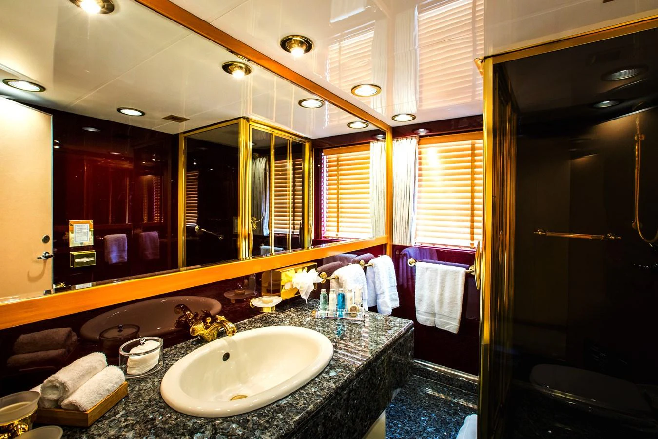 A luxurious yacht bathroom featuring elegant fixtures and a sophisticated design. aboard ESMERALDA Yacht for Sale