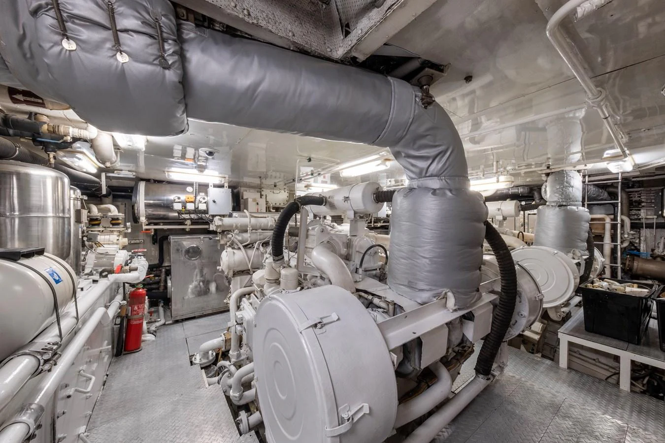 The engine room showcases the yacht's powerful and well-maintained machinery. aboard HAPPY DOLPHIN II Yacht for Sale