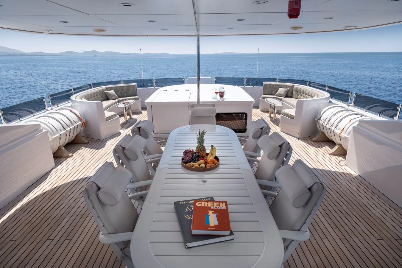 The aft deck offers a spacious and inviting area for alfresco dining and relaxation with stunning sea views. aboard HAPPY DOLPHIN II Yacht for Sale