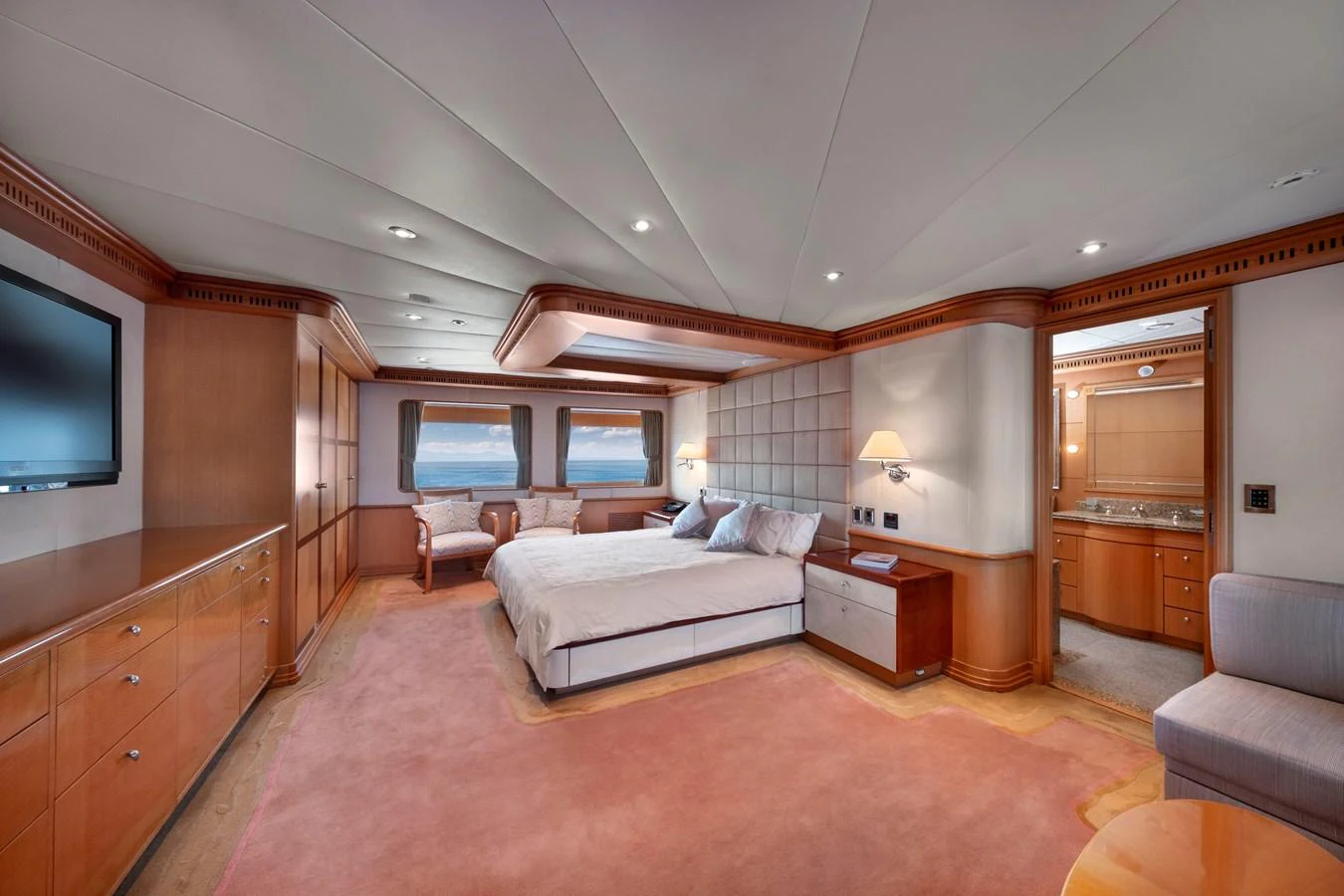 The master stateroom exudes luxury with its spacious layout, elegant furnishings, and panoramic windows. aboard HAPPY DOLPHIN II Yacht for Sale