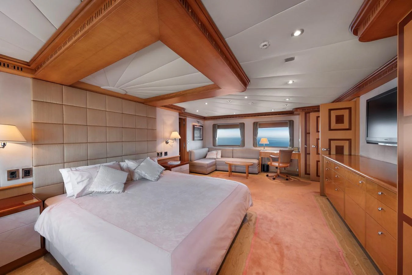 The master stateroom features a spacious layout with luxurious furnishings and large windows offering stunning views. aboard HAPPY DOLPHIN II Yacht for Sale