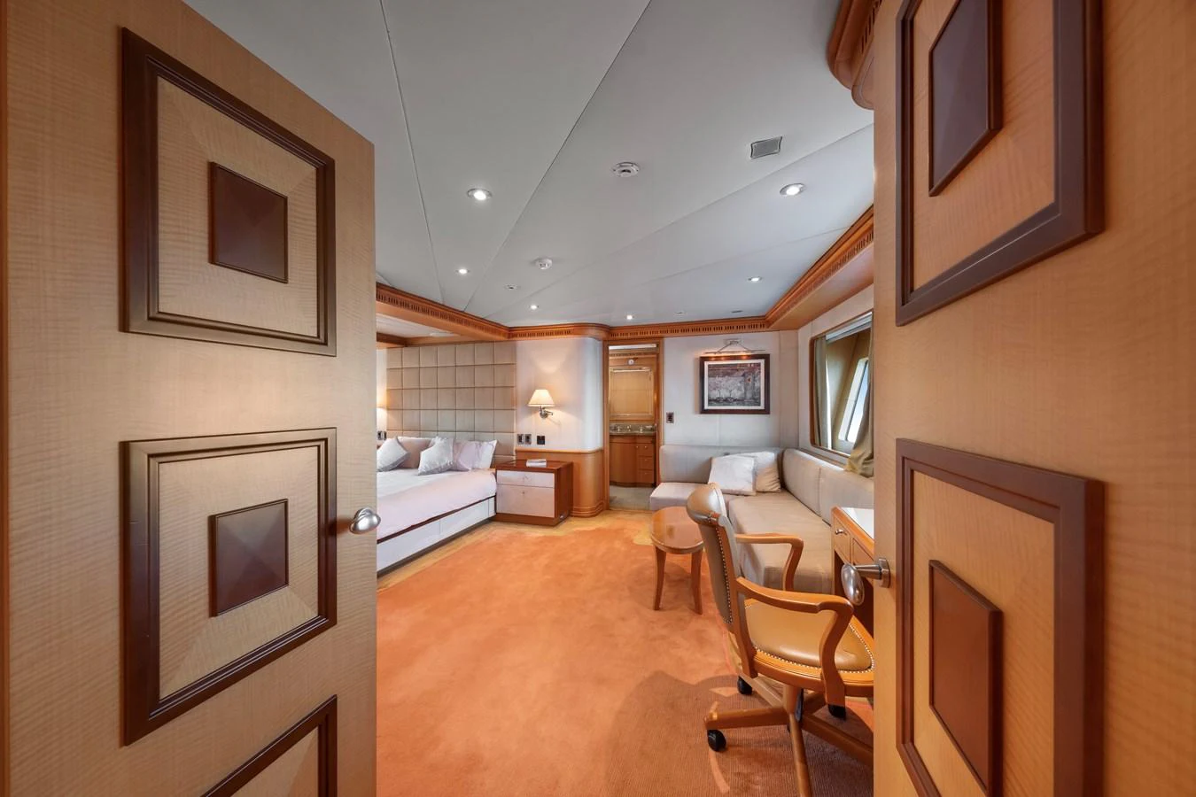 A luxurious stateroom with elegant furnishings and ample natural light. aboard HAPPY DOLPHIN II Yacht for Sale