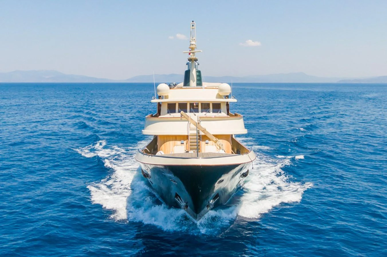 A luxurious yacht cruises through the open sea, showcasing its elegant design and powerful presence. aboard MESERRET Yacht for Sale