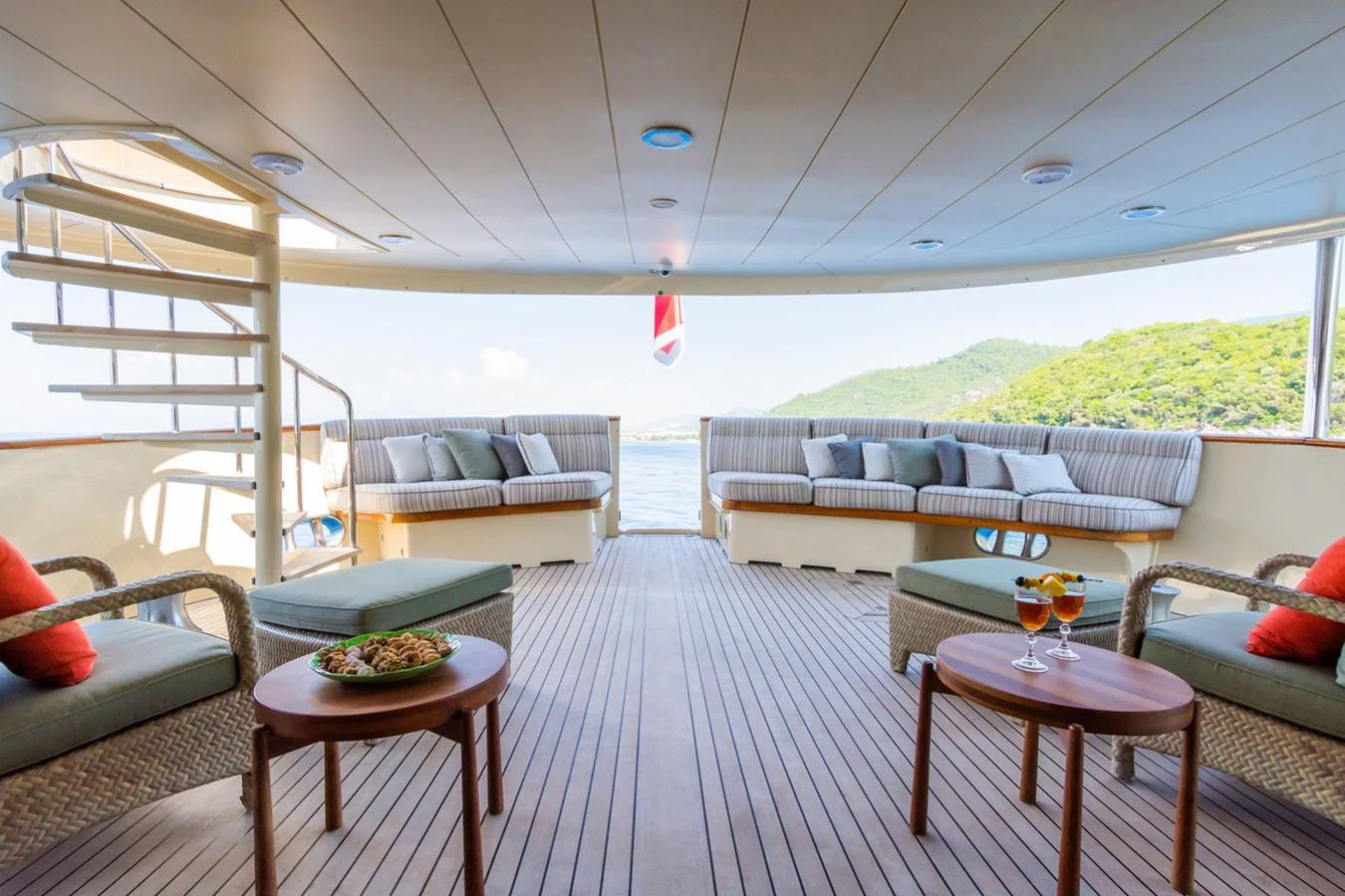 The aft deck offers a spacious and inviting area with comfortable seating and a scenic view. aboard MESERRET Yacht for Sale