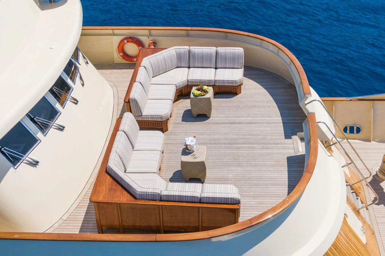 The aft deck features a stylish seating area with a panoramic view of the ocean. aboard MESERRET Yacht for Sale