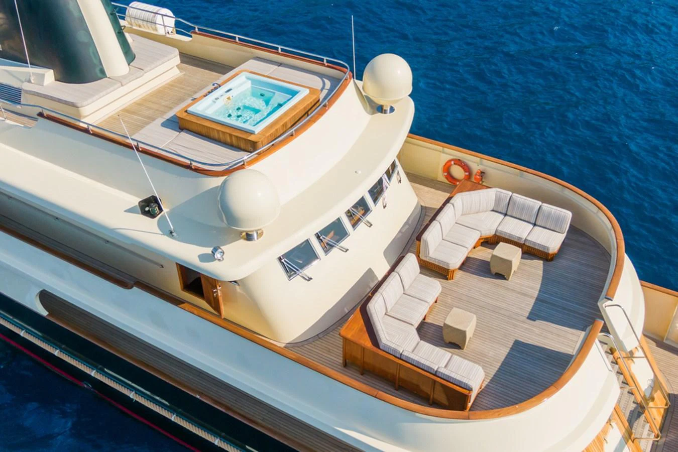 The sundeck features a luxurious seating area and a jacuzzi, perfect for relaxation. aboard MESERRET Yacht for Sale