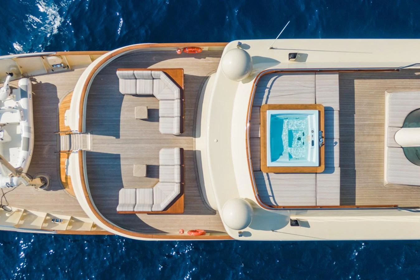 The sundeck features a luxurious seating area and a jacuzzi, perfect for relaxation while cruising. aboard MESERRET Yacht for Sale