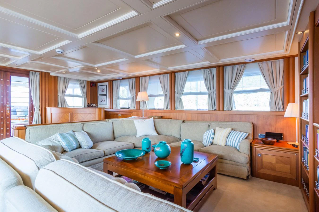 The salon features a spacious and comfortable seating area with elegant decor and ample natural light. aboard MESERRET Yacht for Sale