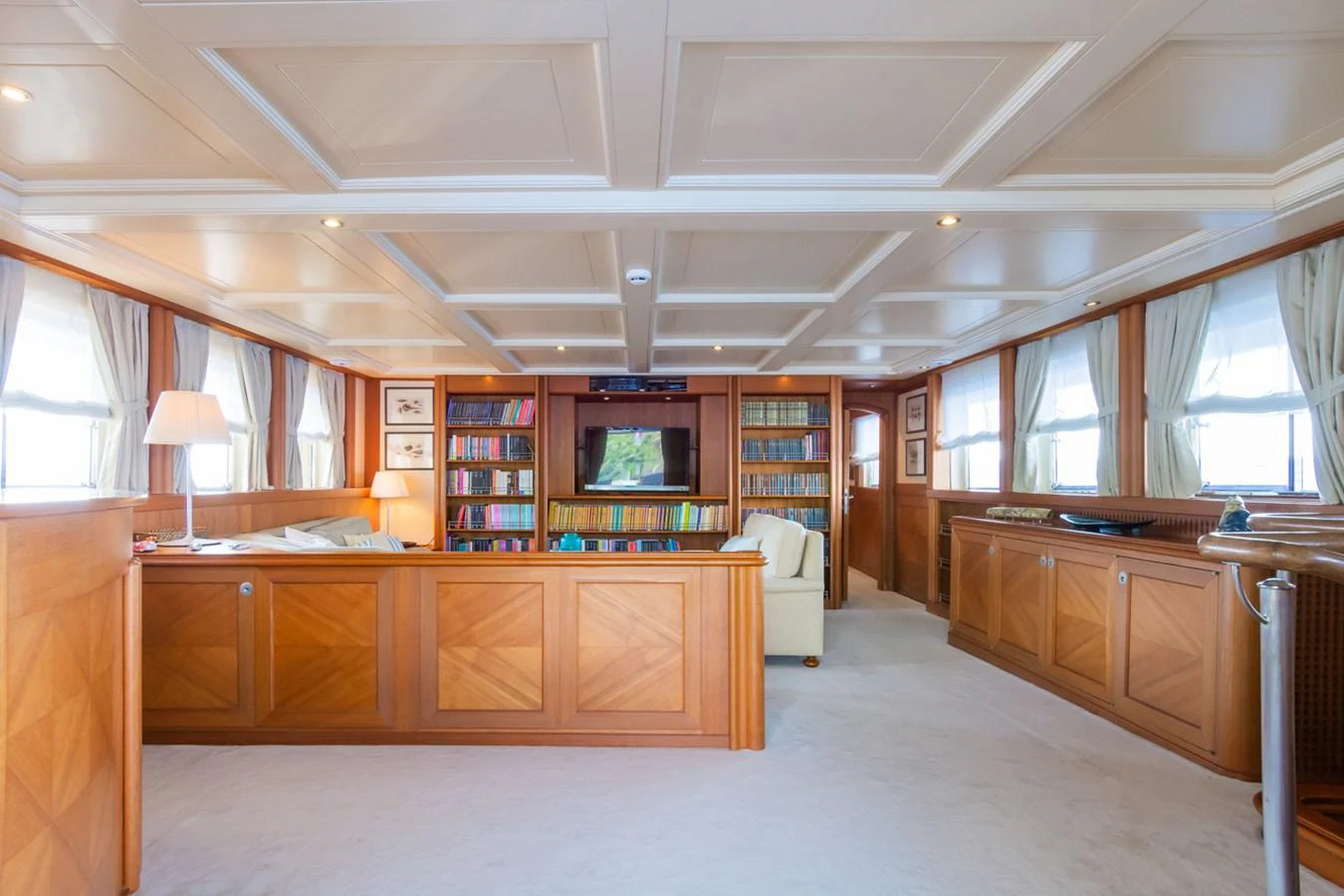 The yacht's library offers a serene and elegant space for reading and relaxation. aboard MESERRET Yacht for Sale
