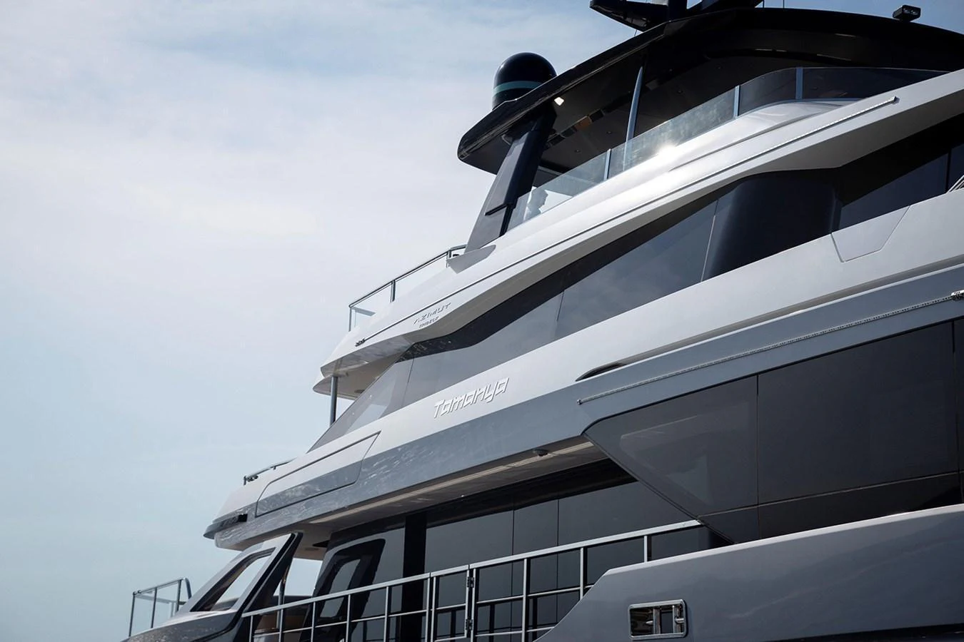 A sleek and modern yacht exterior showcasing its elegant lines and luxurious design. aboard TAMANYA Yacht for Sale