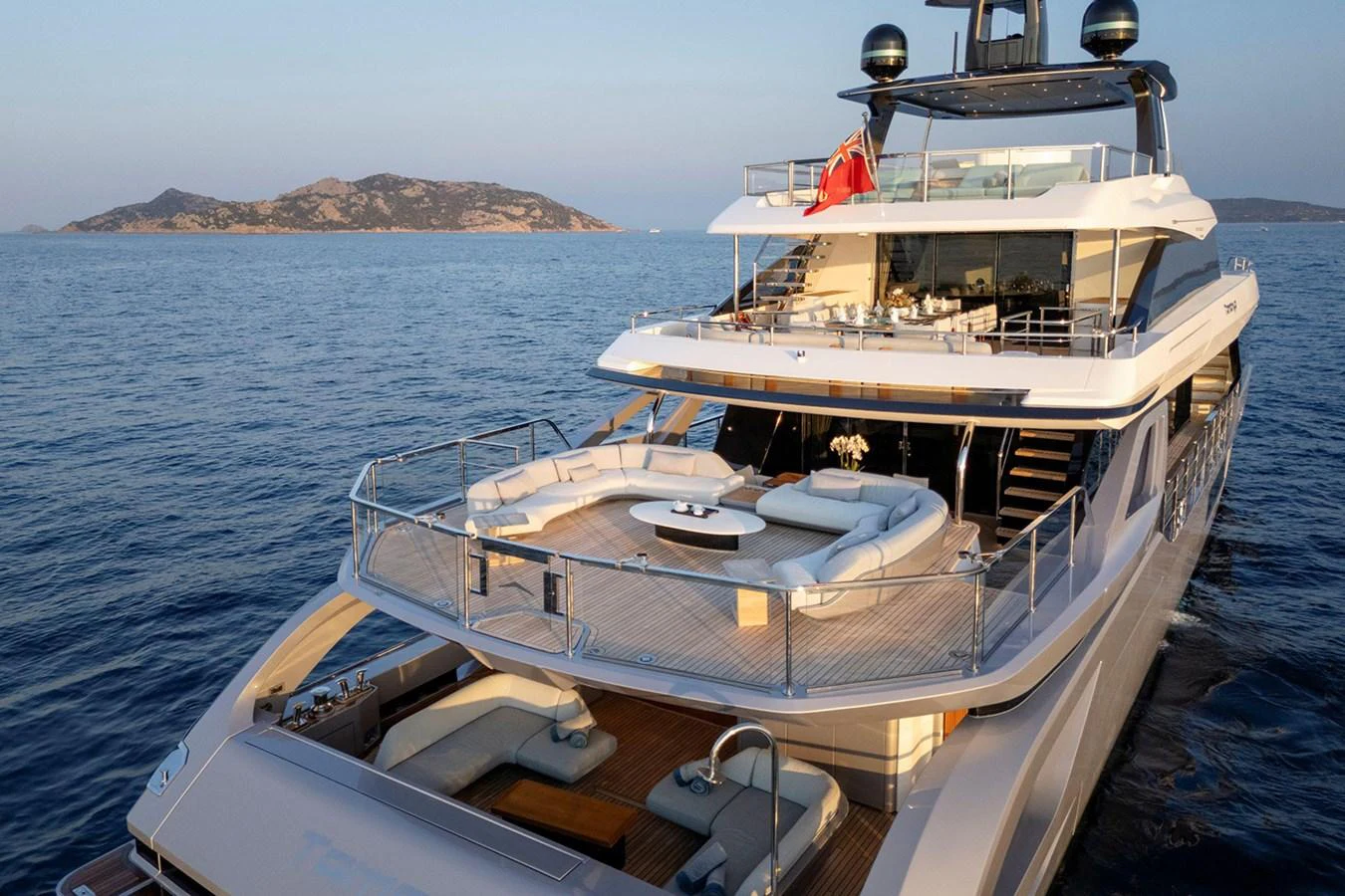 The yacht's aft deck features luxurious seating areas with stunning views of the surrounding waters. aboard TAMANYA Yacht for Sale