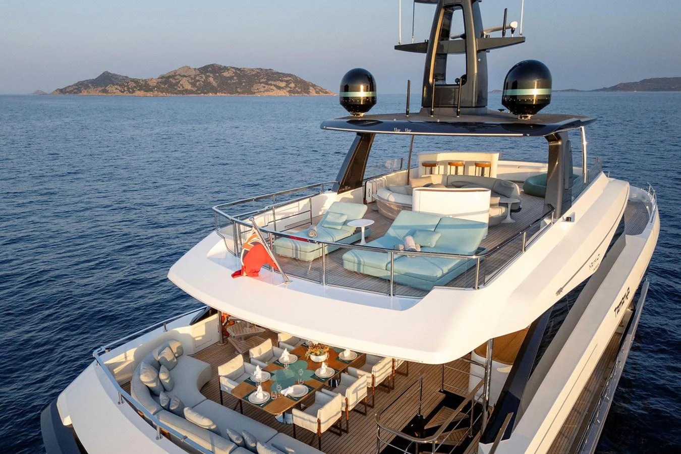 The yacht's aft deck features luxurious lounging areas with stunning ocean views. aboard TAMANYA Yacht for Sale