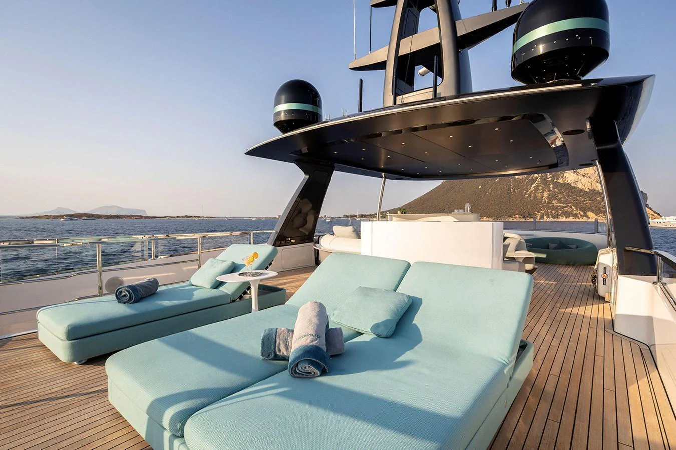 The sundeck offers luxurious lounging with plush sunbeds and stunning ocean views. aboard TAMANYA Yacht for Sale