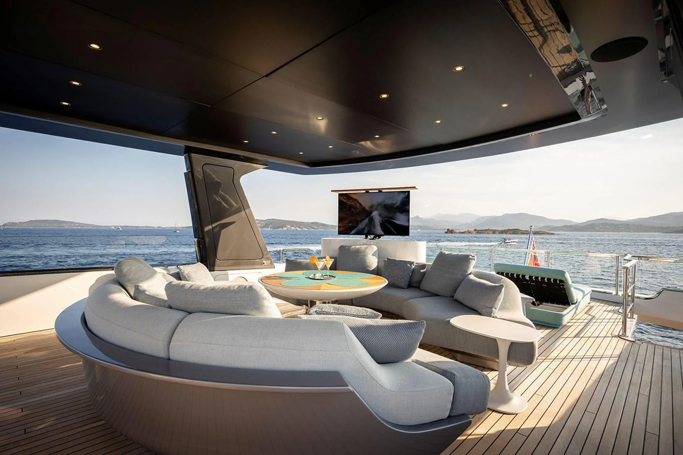 The aft deck features a luxurious seating area with panoramic ocean views. aboard TAMANYA Yacht for Sale