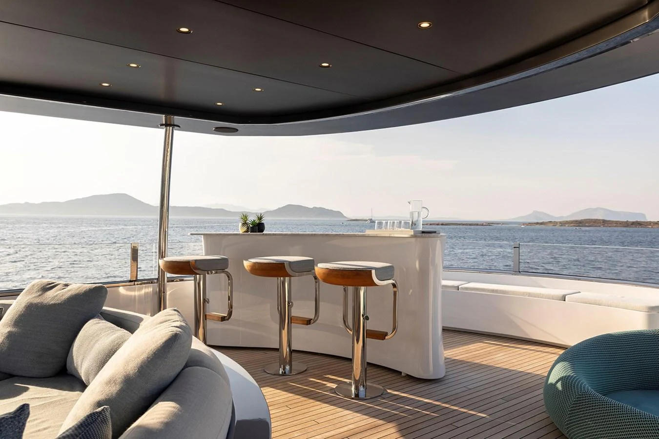 A stylish bar area on the yacht's deck offers stunning sea views. aboard TAMANYA Yacht for Sale