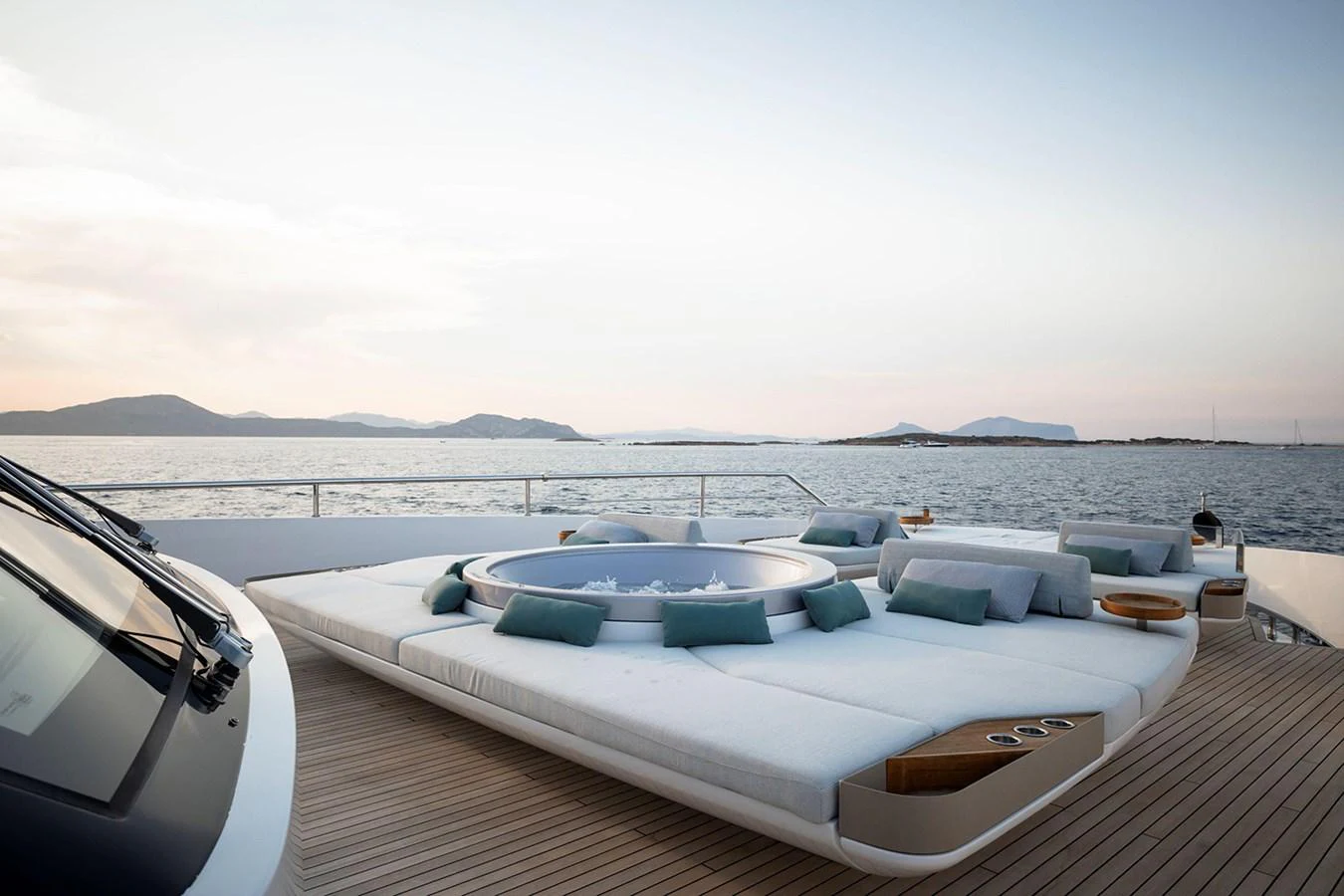 The sundeck features a luxurious jacuzzi surrounded by plush sunbeds, offering stunning sea views. aboard TAMANYA Yacht for Sale