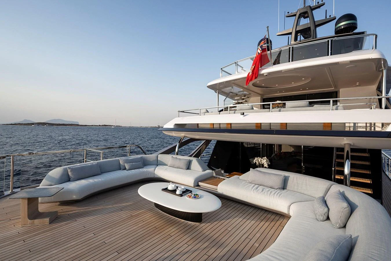 The aft deck features a spacious lounging area with plush seating and a modern coffee table, perfect for relaxation and socializing. aboard TAMANYA Yacht for Sale