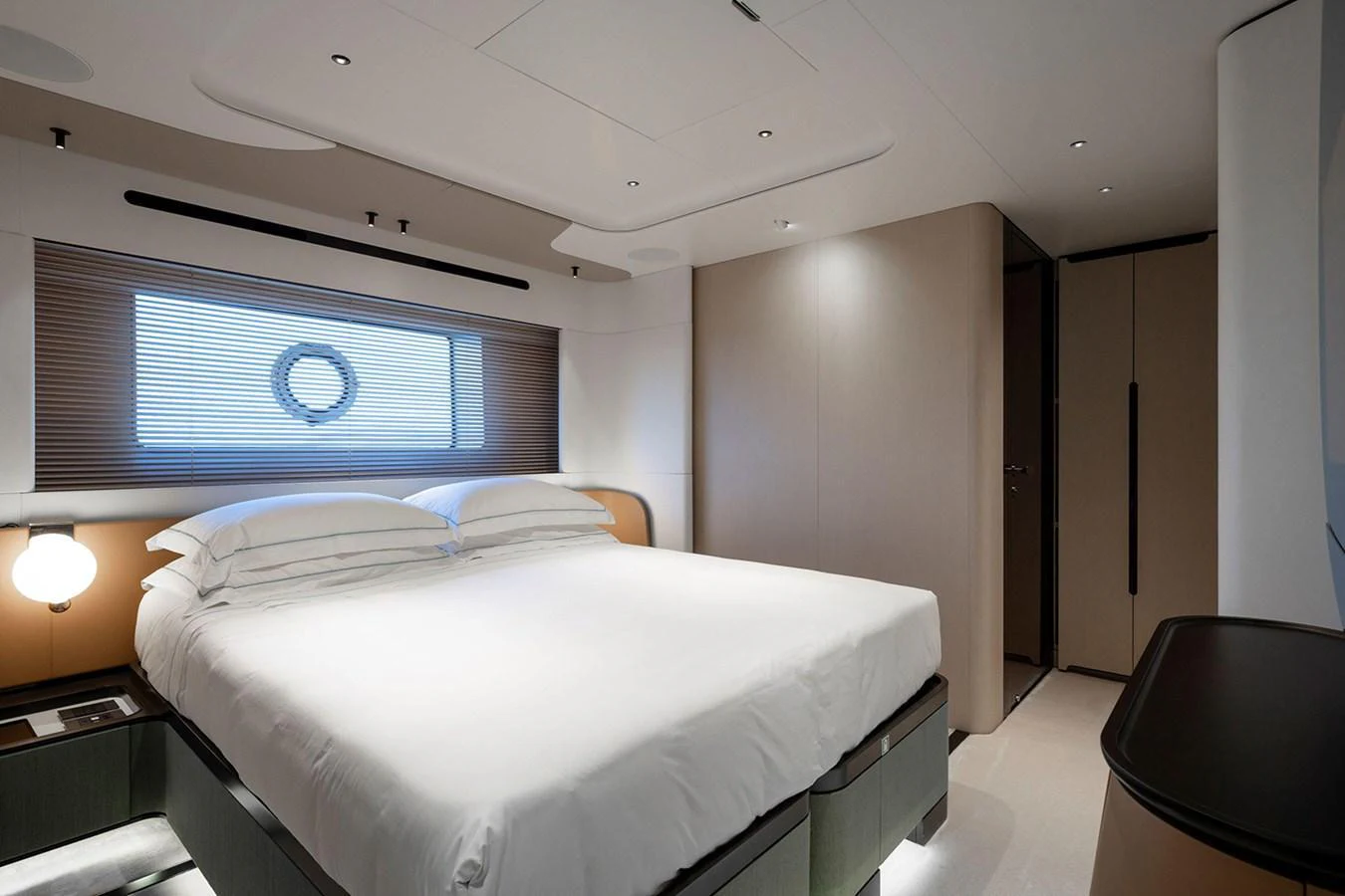 A luxurious stateroom featuring a large bed and modern decor. aboard TAMANYA Yacht for Sale