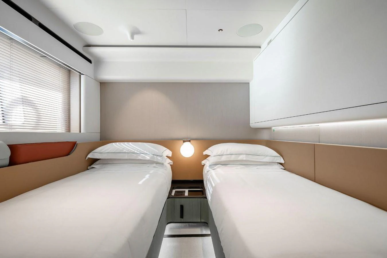 The twin stateroom features modern design with two single beds and ample natural light. aboard TAMANYA Yacht for Sale