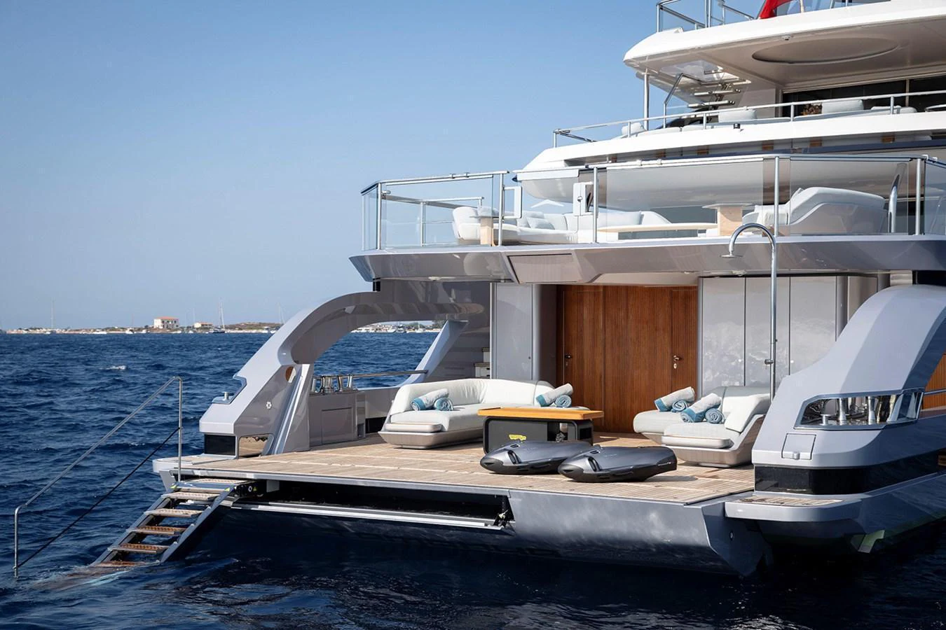 The yacht's aft deck features luxurious lounging areas with direct access to the water. aboard TAMANYA Yacht for Sale